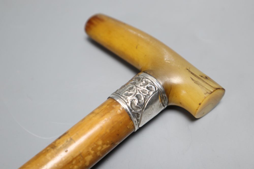 An Edwardian rhinoceros horn handled walking stick, length 88cm